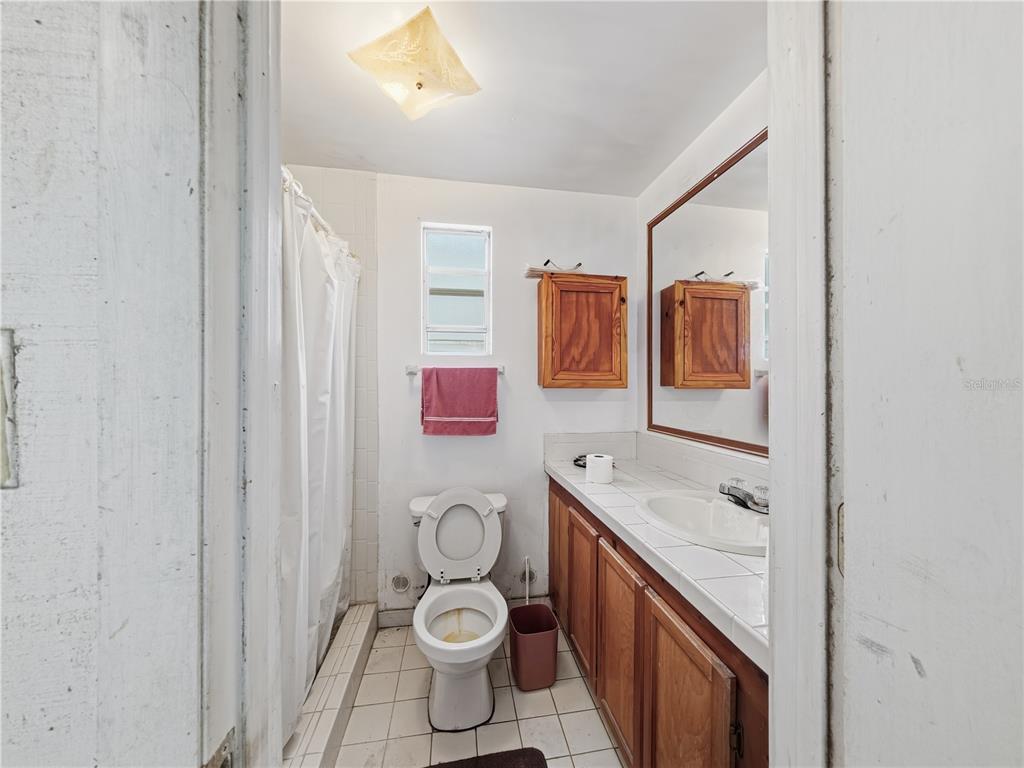21210 137th Drive O'Brien, FL 32071 - Photo 33 of 49 a bathroom with a sink toilet and vanity