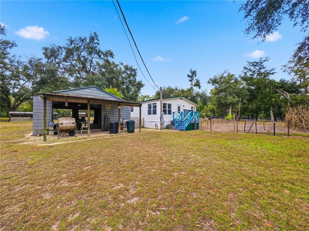 21210 137th Drive O'Brien, FL 32071 - Photo 36 of 49 a view of a house with a yard and sitting area