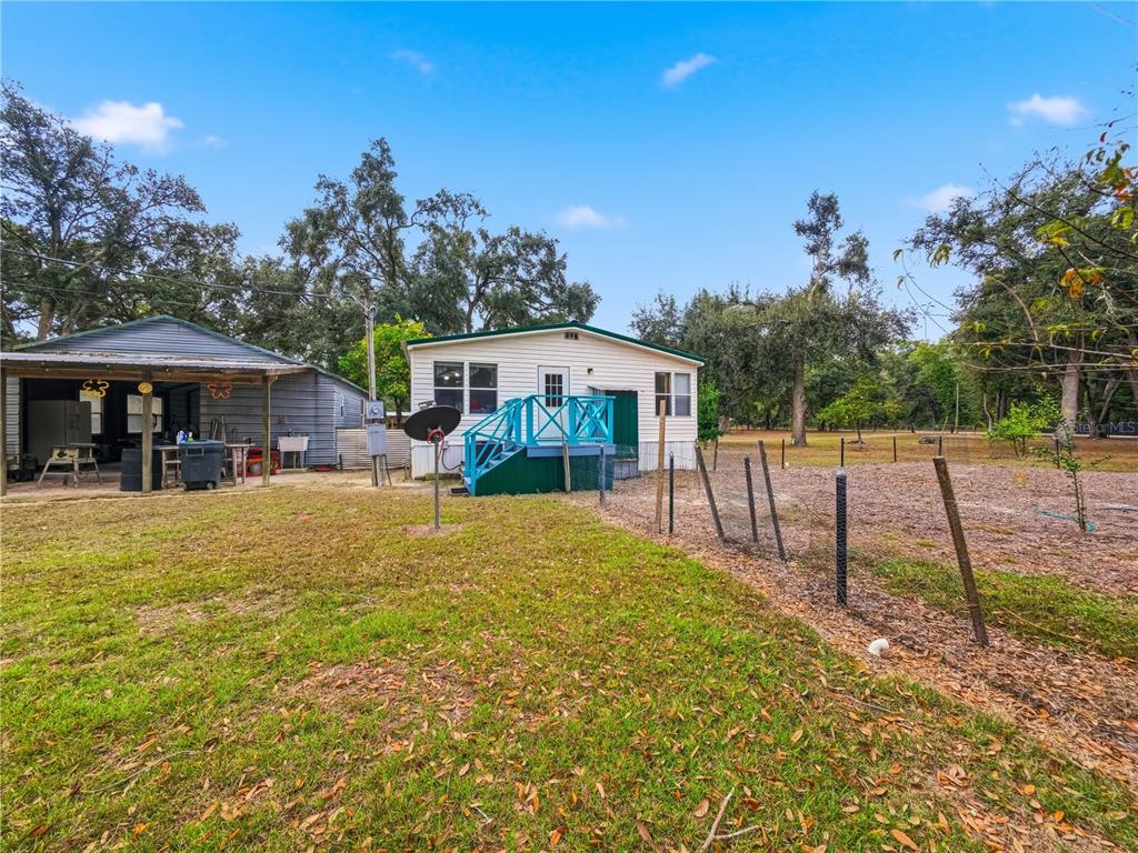 21210 137th Drive O'Brien, FL 32071 - Photo 37 of 49 a view of a house with swimming pool and sitting area
