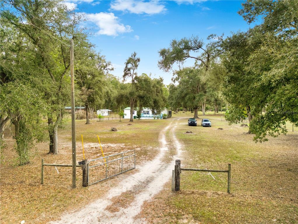 21210 137th Drive O'Brien, FL 32071 - Photo 38 of 49 a view of a swimming pool with a bench
