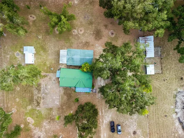 a backyard of a house with a yard with outdoor seating