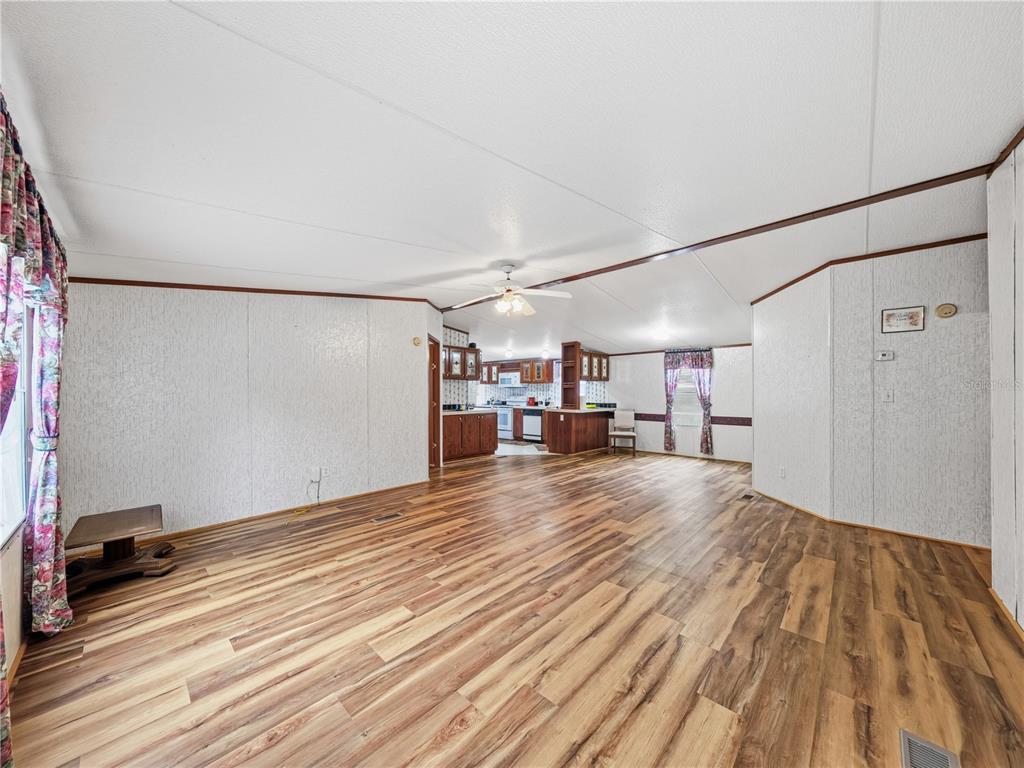 21210 137th Drive O'Brien, FL 32071 - Photo 5 of 49 a view of a room with wooden floor