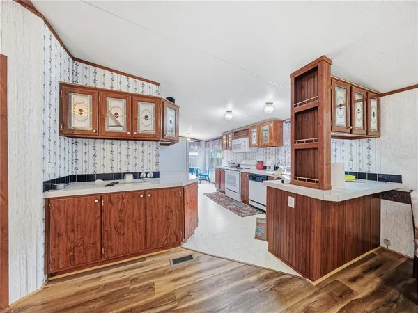 a kitchen with stainless steel appliances granite countertop a stove and a sink