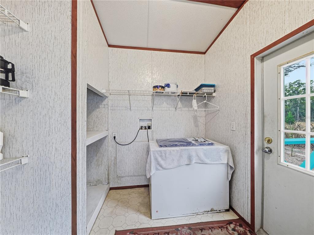 21210 137th Drive O'Brien, FL 32071 - Photo 9 of 49 a bathroom with a granite countertop sink a toilet and shower