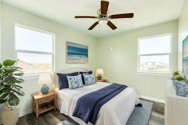 a bedroom with a balcony a bed and a window