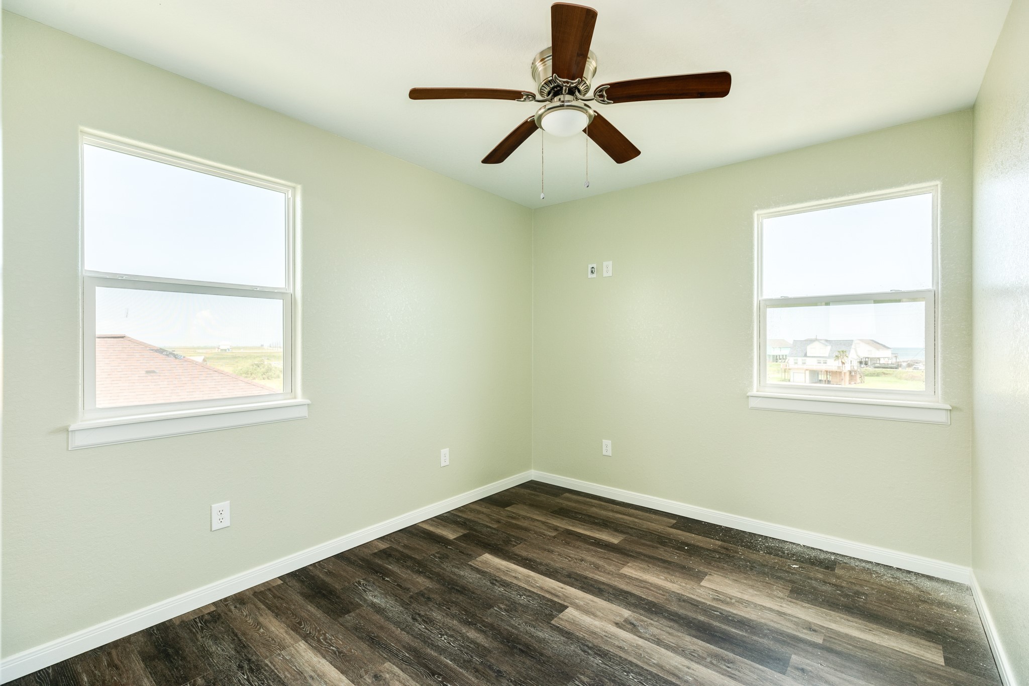 4726 Palm Street Freeport, TX 77541 - Photo 13 of 30 a view of empty room with wooden floor and window
