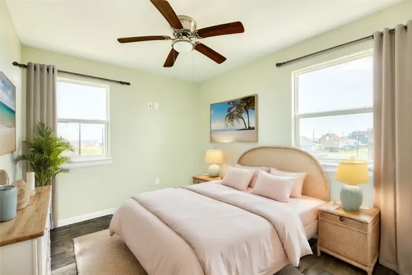 a bedroom with a large bed chandelier and a window
