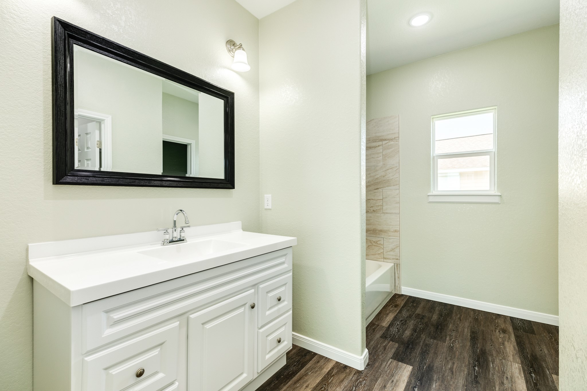 4726 Palm Street Freeport, TX 77541 - Photo 17 of 30 a bathroom with a toilet sink and mirror