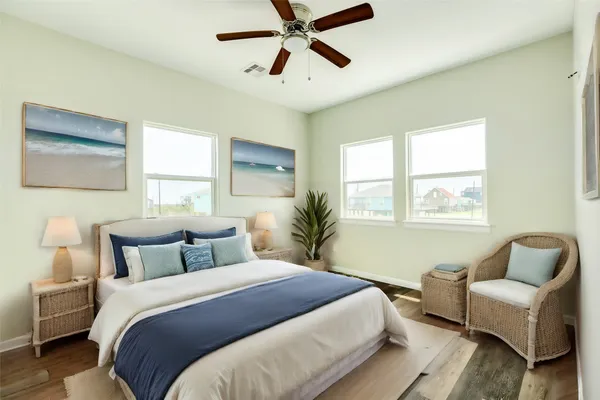 a bedroom with a bed couch and window