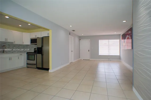 a view of a kitchen with a sink and dishwasher cabinets