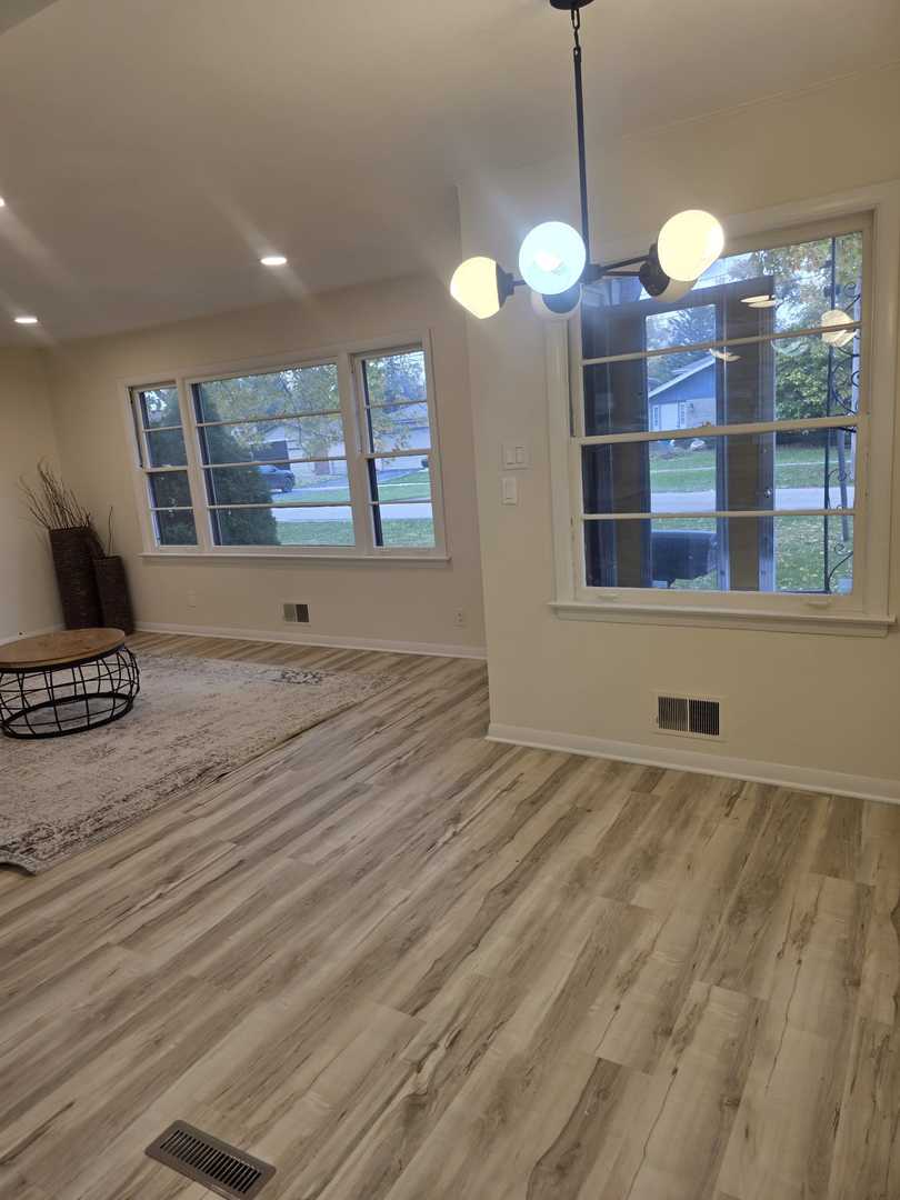 4905 143rd Place Midlothian, IL 60445 - Photo 5 of 17 a view of an empty room with a window