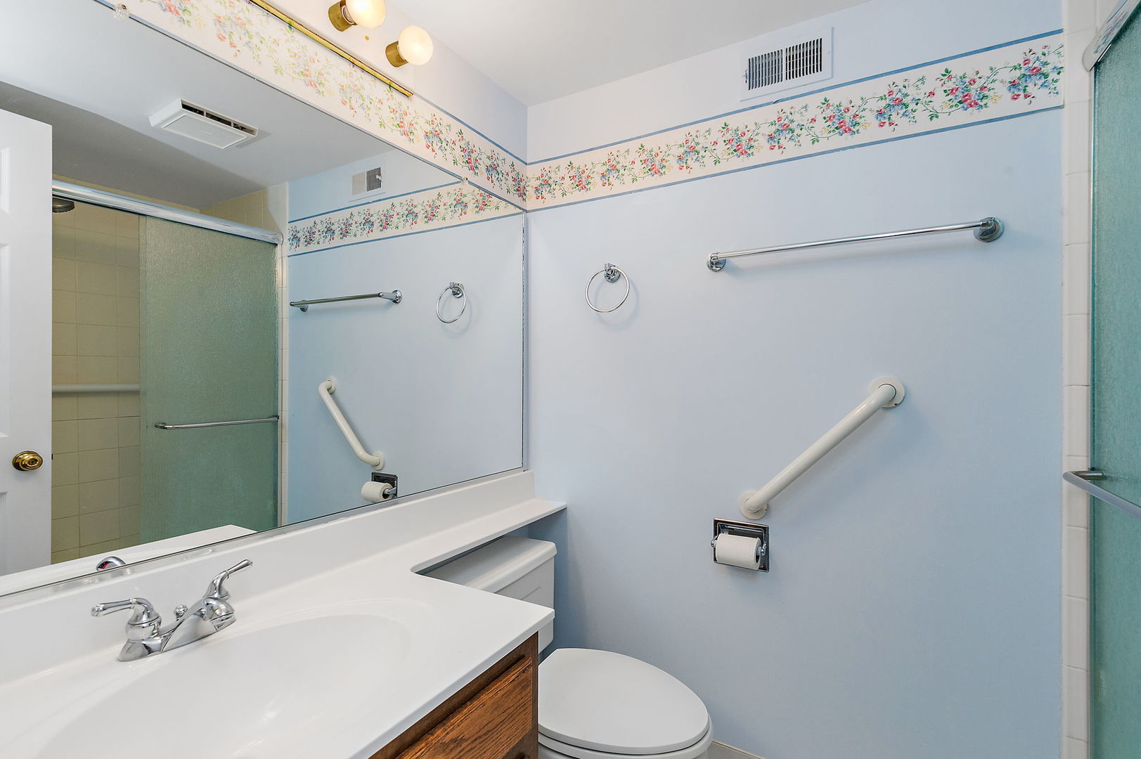 25 Shoreline Road, Unit D Lake Barrington, IL 60010 - Photo 16 of 43 a bathroom with a sink a toilet and shower