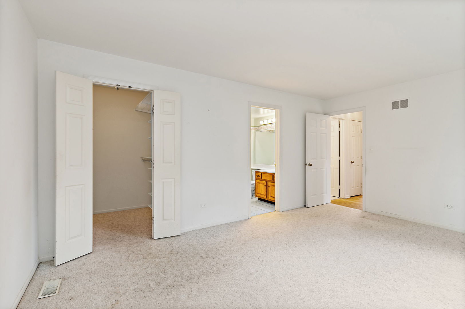 25 Shoreline Road, Unit D Lake Barrington, IL 60010 - Photo 18 of 43 a view of an empty room with a window