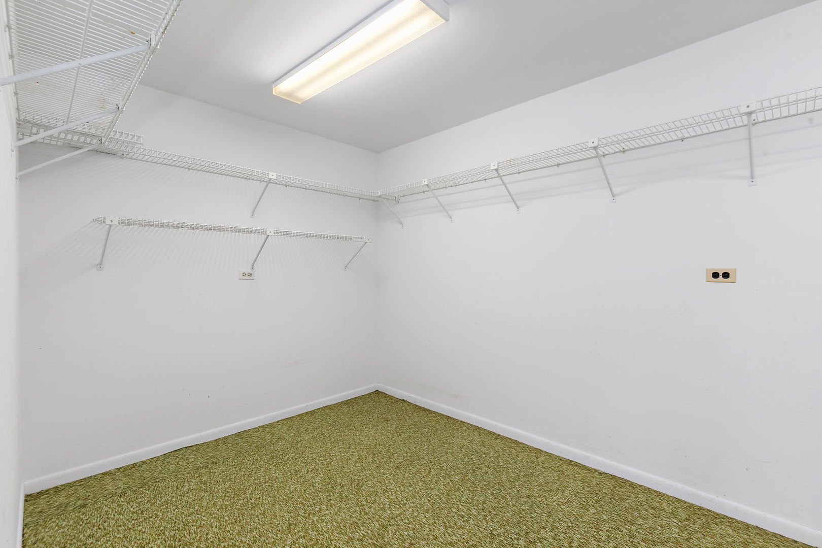 25 Shoreline Road, Unit D Lake Barrington, IL 60010 - Photo 28 of 43 a view of a room with racks on the wall