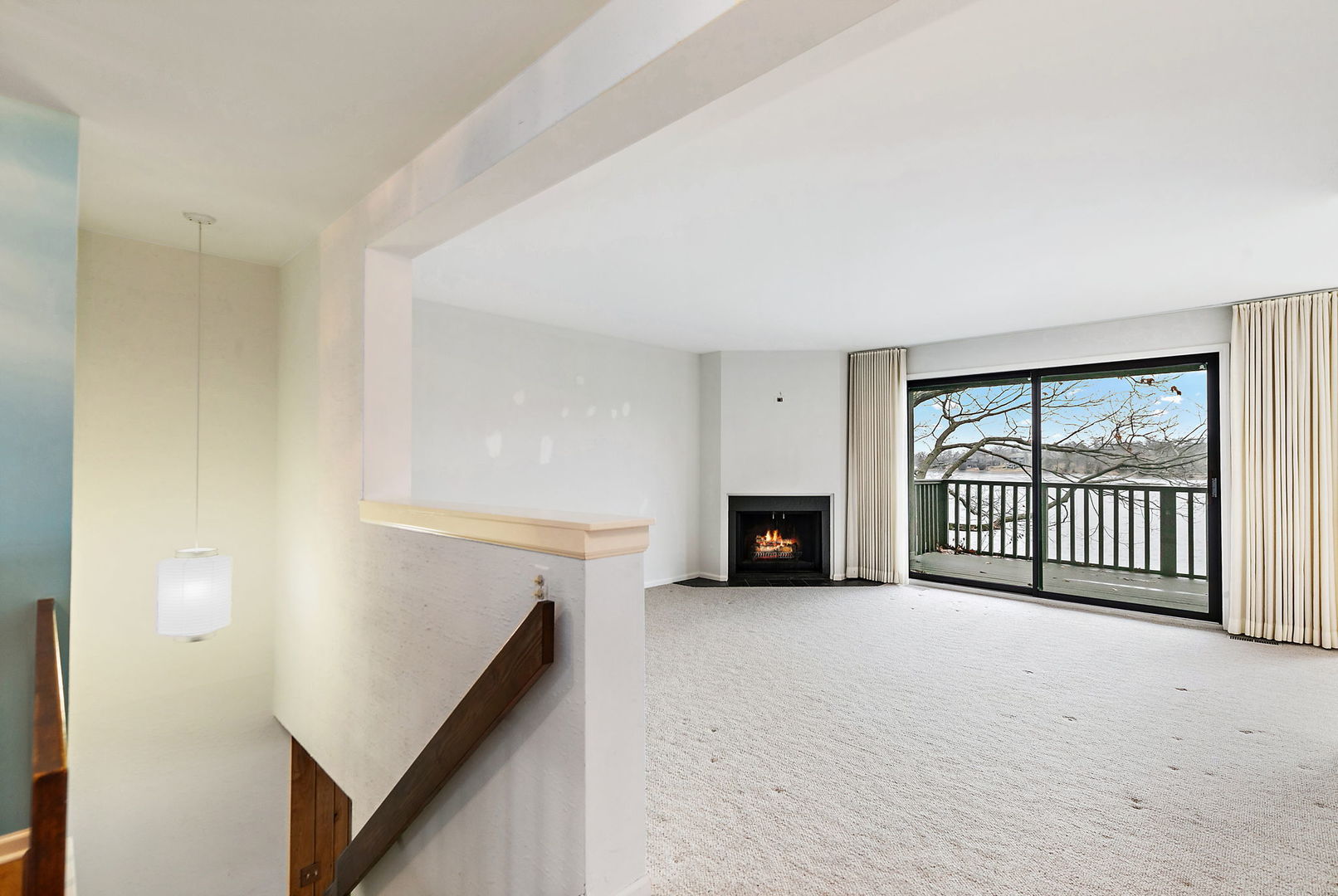 25 Shoreline Road, Unit D Lake Barrington, IL 60010 - Photo 3 of 43 a view of an empty room with a fireplace