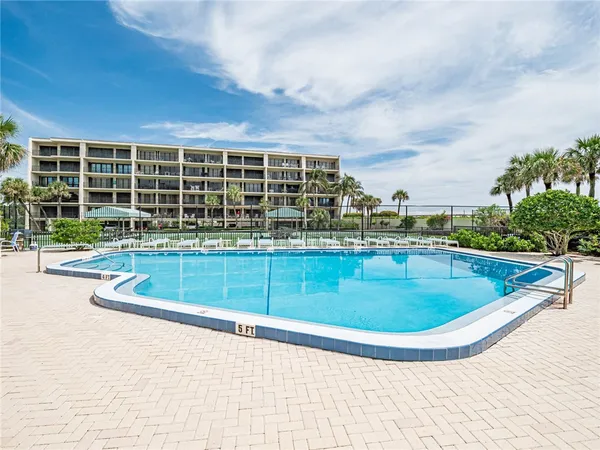 swimming pool view with a outdoor seating