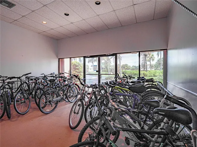 a lot of bicycles parked in a room