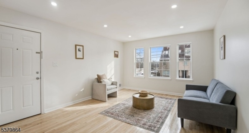 695 South 11th Street Newark, NJ 07103 - Photo 7 of 13 a living room with furniture and a window