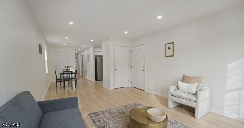 695 South 11th Street Newark, NJ 07103 - Photo 9 of 13 a living room with furniture and a wooden floor