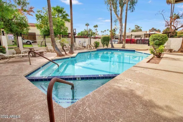 a view of a swimming pool with a patio