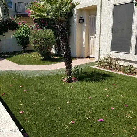 a backyard of a house with lots of green space