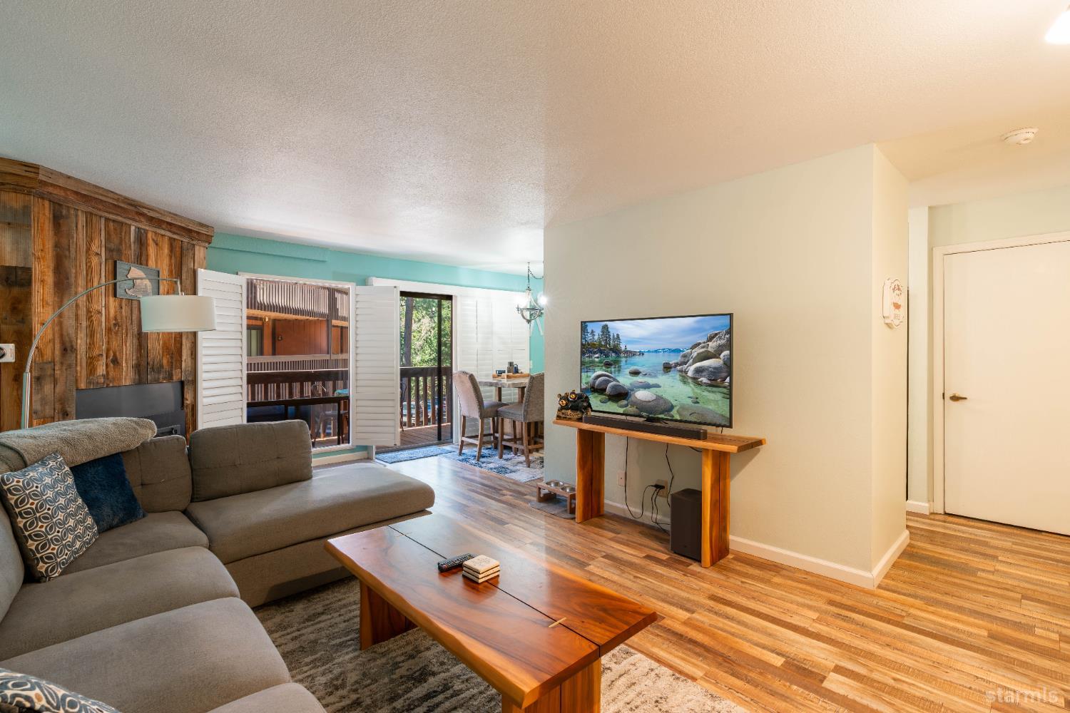 1439 Ski Run Boulevard, Unit H4 South Lake Tahoe, CA 96150 - Photo 1 of 18 a living room with furniture and a flat screen tv