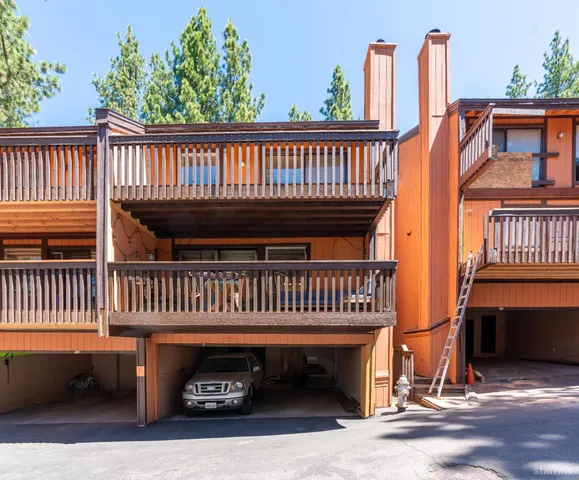 a dining room with wooden floor and breakfast area