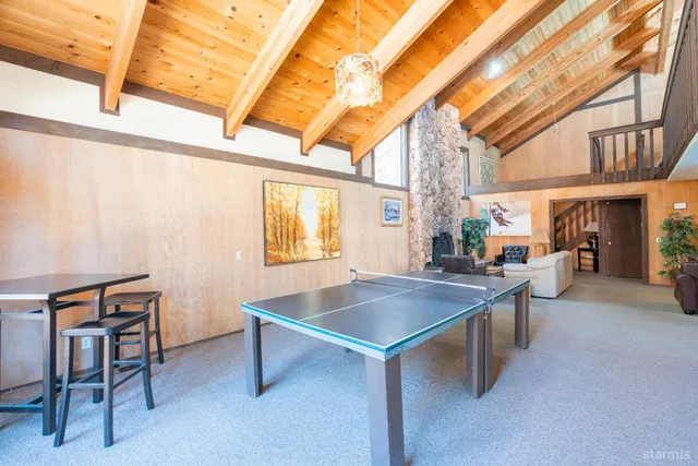 a outdoor living space with patio furniture and a fireplace