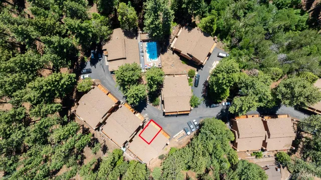an aerial view of a house with outdoor space and street view