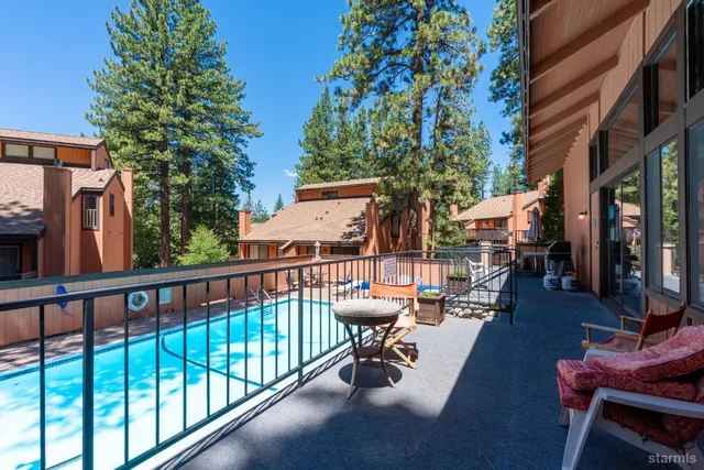 a view of swimming pool with outdoor seating