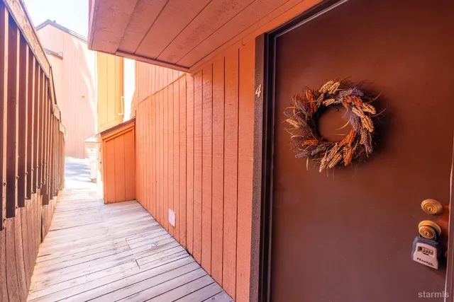 a view of a entryway door with wooden floor