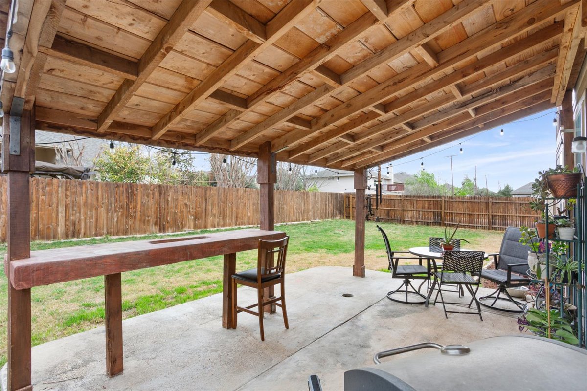 1500 Cliffbrake Way Georgetown, TX 78626 - Photo 31 of 35 Fenced backyard with extended covered patio