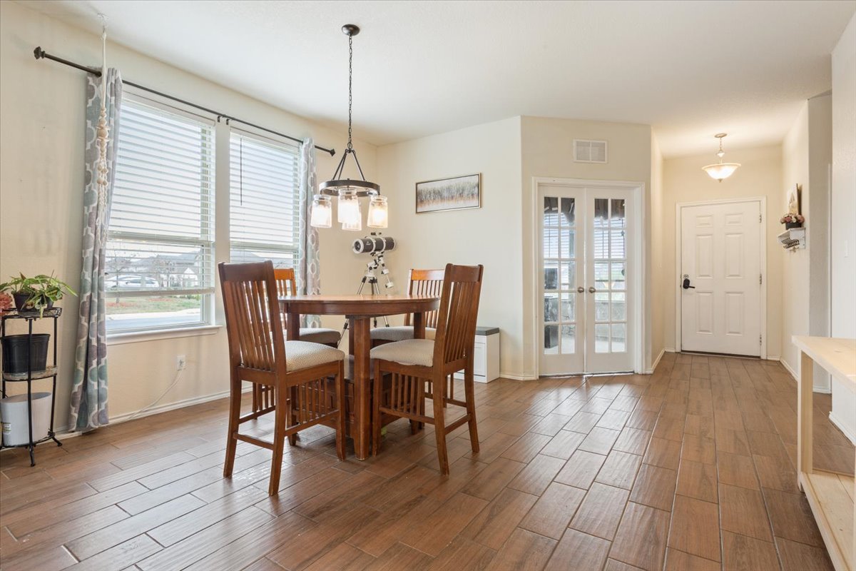 1500 Cliffbrake Way Georgetown, TX 78626 - Photo 7 of 35 Dining room featuring wood style floors and plenty of natural light