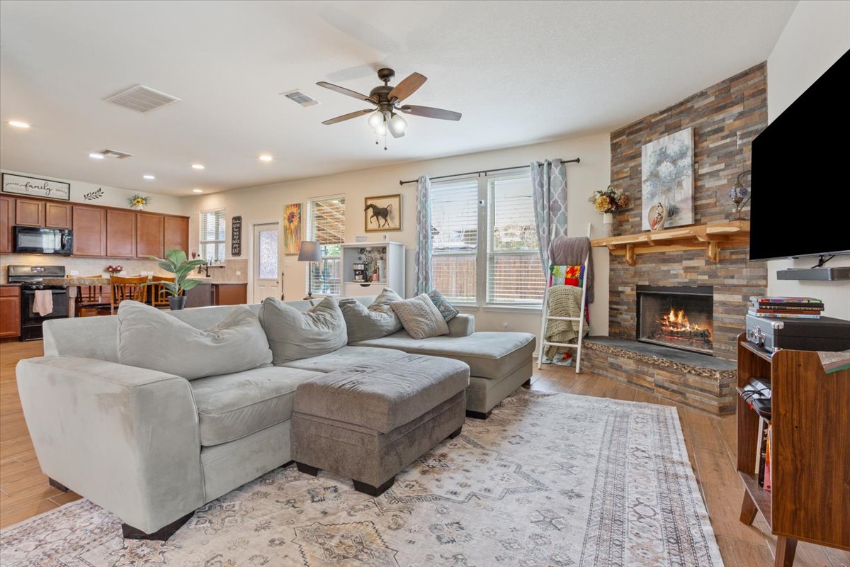 1500 Cliffbrake Way Georgetown, TX 78626 - Photo 10 of 35 Living room featuring lopens into the kitchen