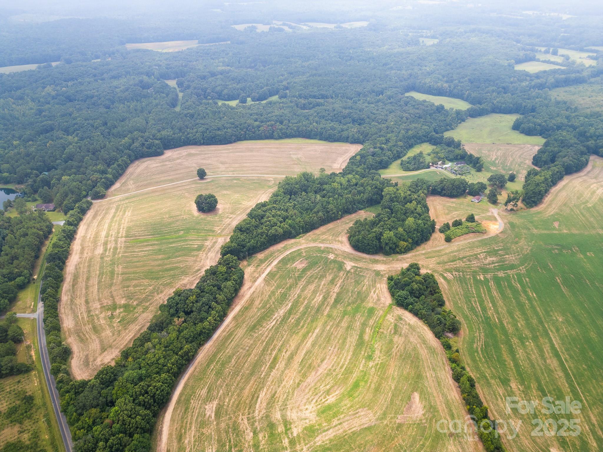 7602 Gus Eubanks Road Monroe, NC 28112 - Photo 14 of 22 a view of a swimming pool in a backyard