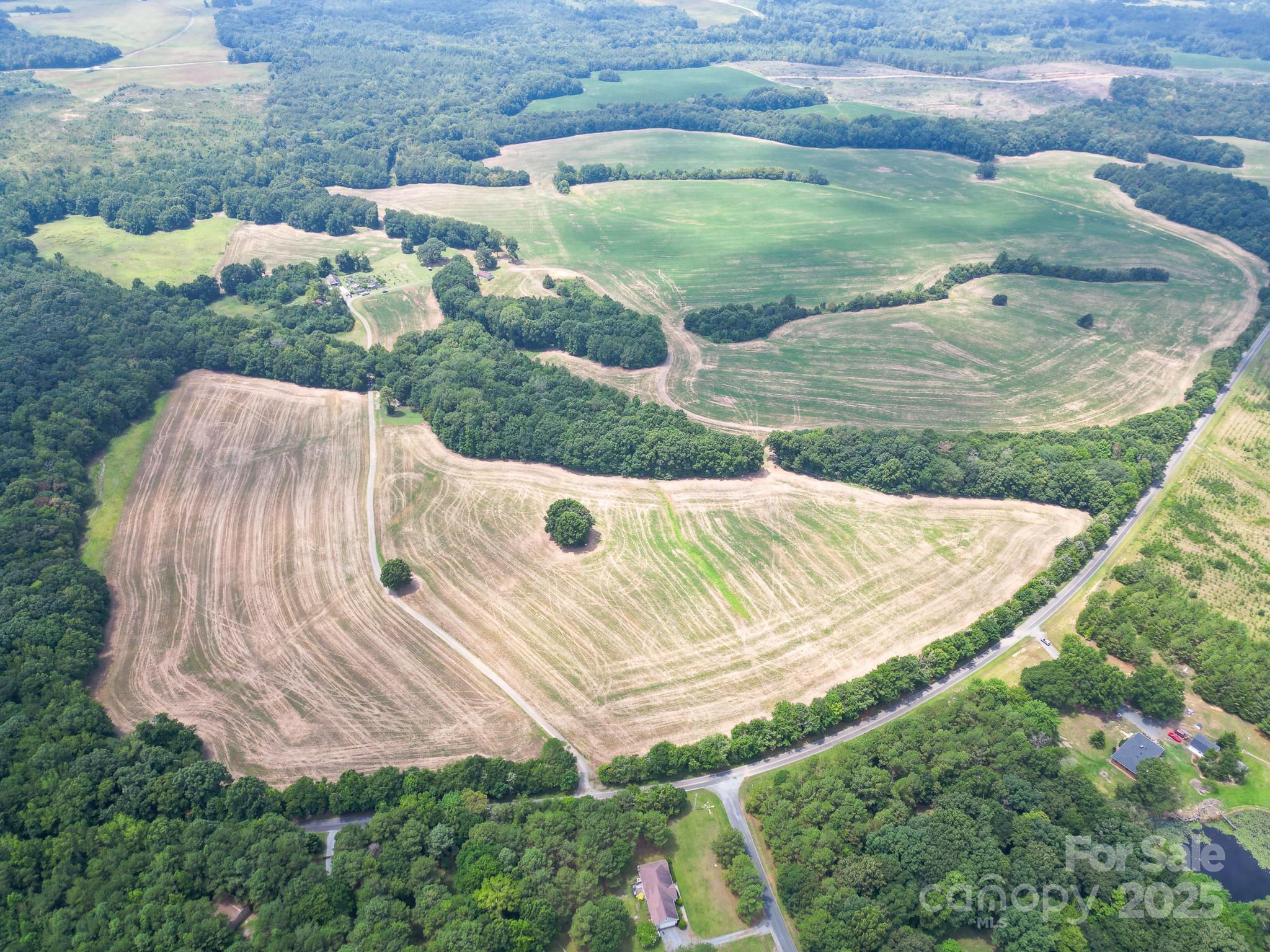 7602 Gus Eubanks Road Monroe, NC 28112 - Photo 2 of 22 a view of a backyard with plants