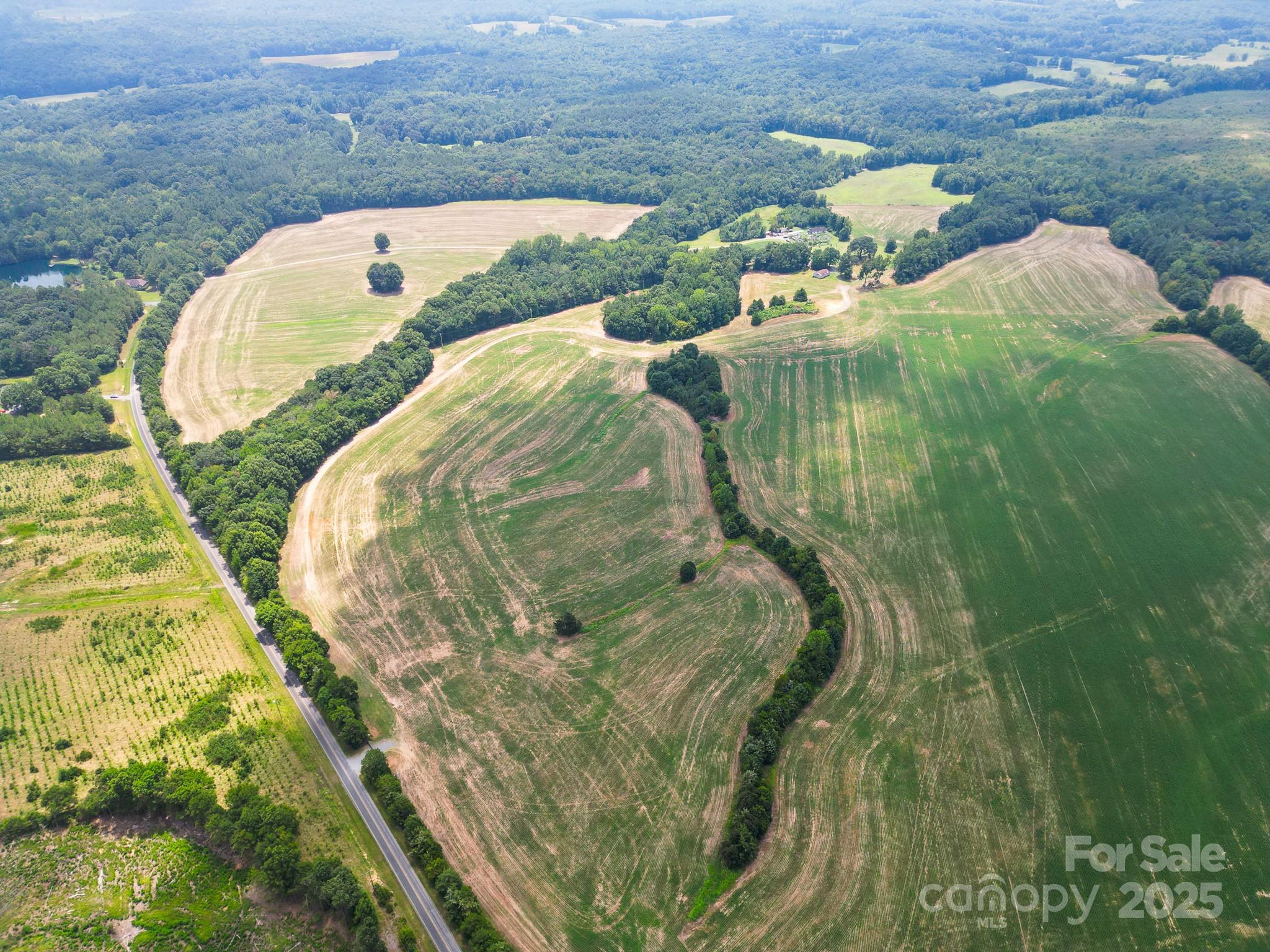 7602 Gus Eubanks Road Monroe, NC 28112 - Photo 4 of 22 a view of swimming pool with a garden and seating space