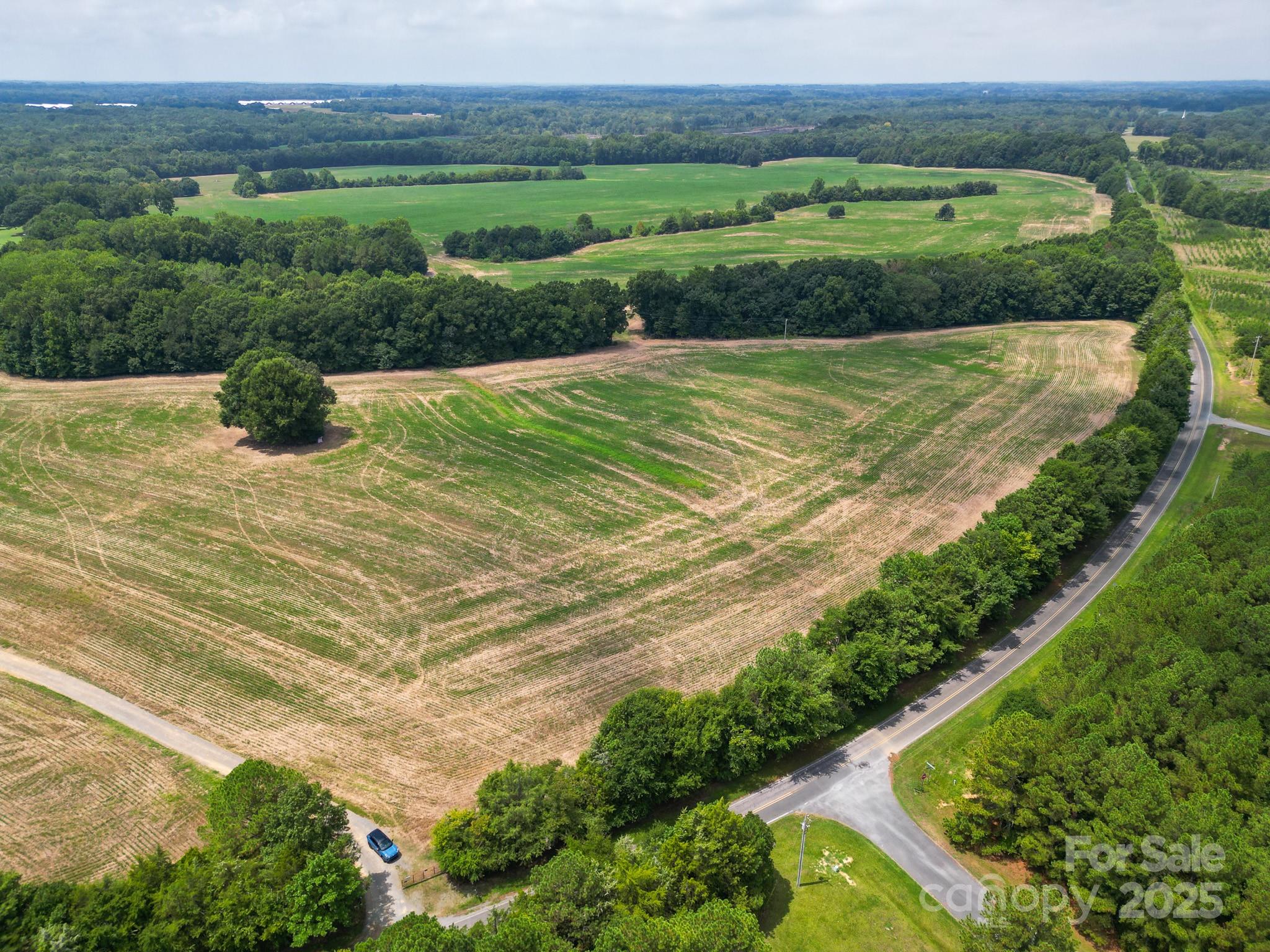 7602 Gus Eubanks Road Monroe, NC 28112 - Photo 10 of 22 a view of a lake with a yard