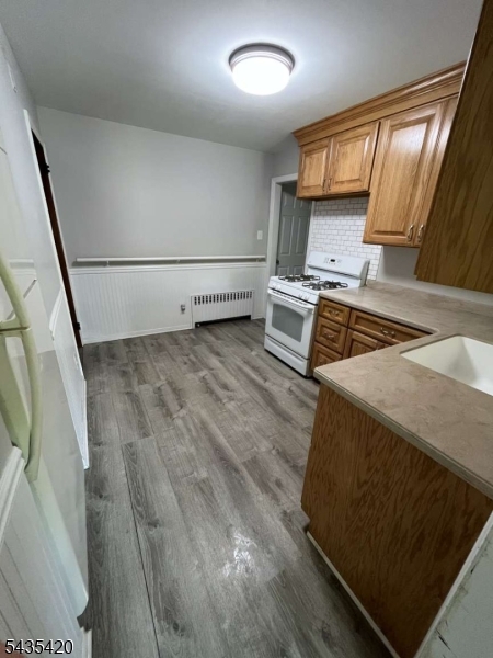 619 Foothill Road Bridgewater, NJ 08807 - Photo 16 of 23 a kitchen with wooden cabinets and a stove top oven