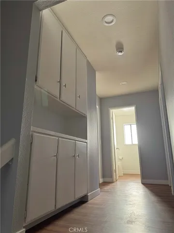 a view of an empty room and closet area