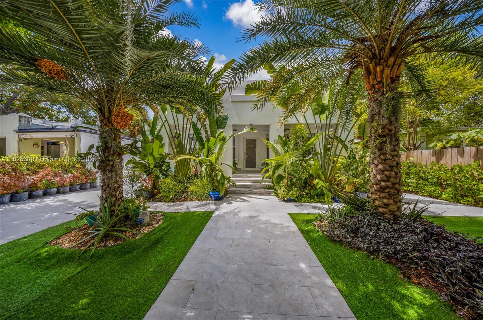 120 Northwest 49th Street Miami, FL 33127 - Photo 1 of 35 a front view of a house with garden
