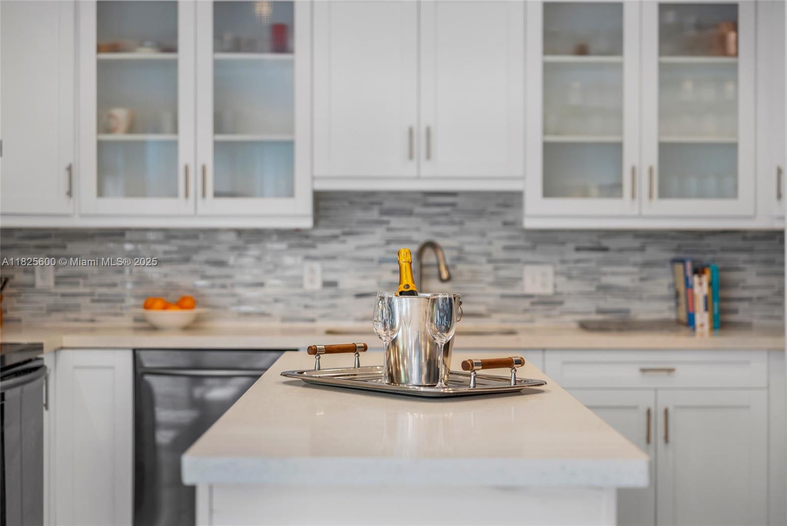 120 Northwest 49th Street Miami, FL 33127 - Photo 12 of 35 a kitchen with a sink and cabinets