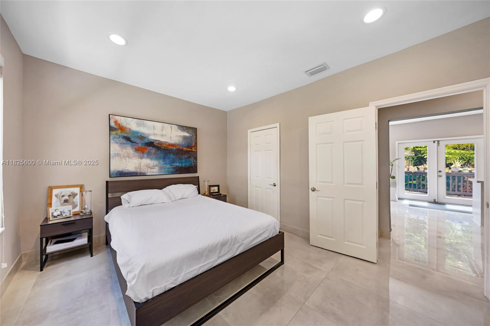 120 Northwest 49th Street Miami, FL 33127 - Photo 13 of 35 a bedroom with a bed and a painting on the wall