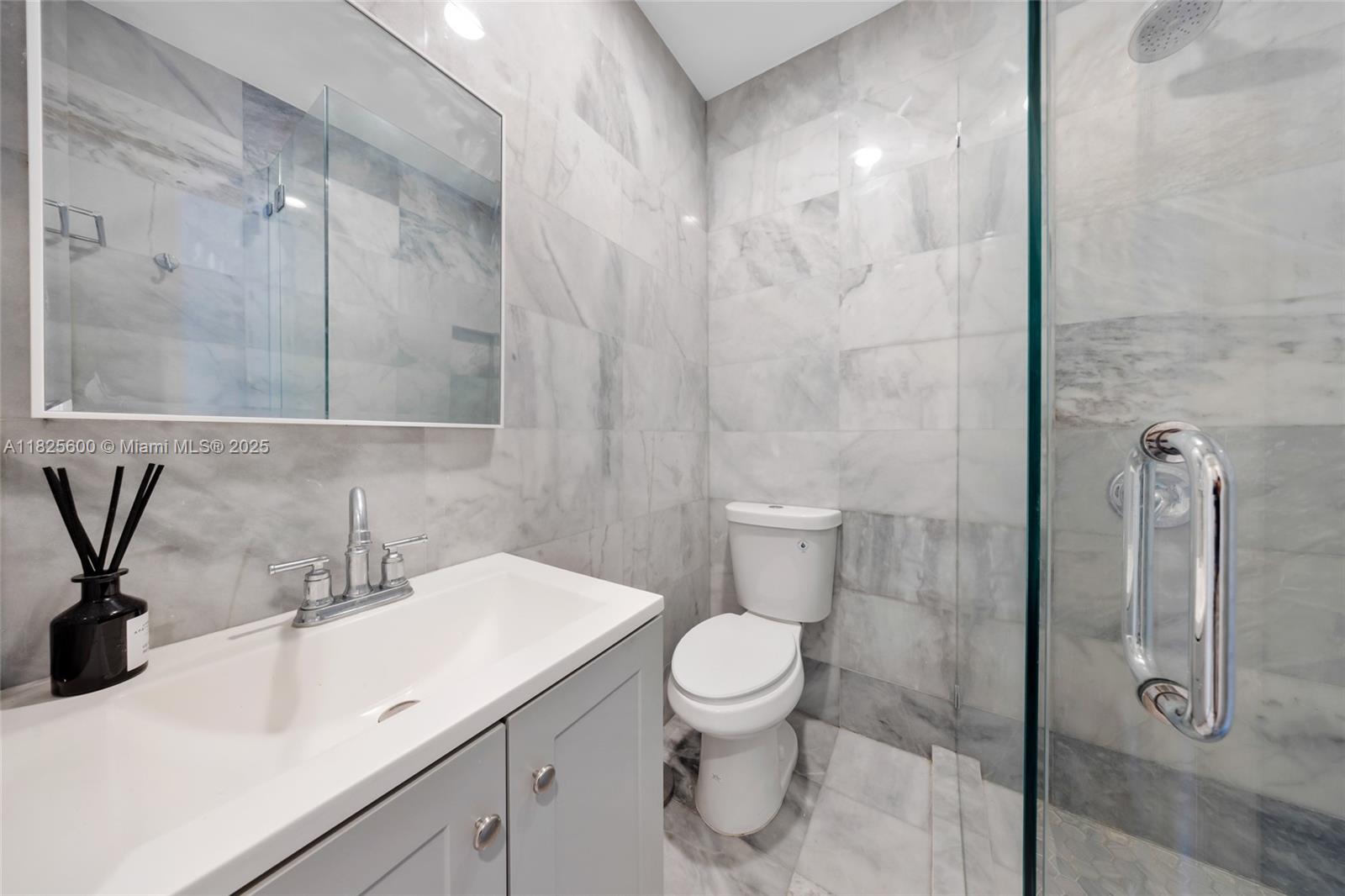 120 Northwest 49th Street Miami, FL 33127 - Photo 18 of 35 a bathroom with a sink a toilet and shower