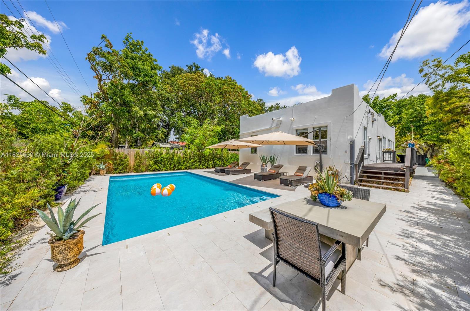 120 Northwest 49th Street Miami, FL 33127 - Photo 23 of 35 a view of a chairs and table in the patio