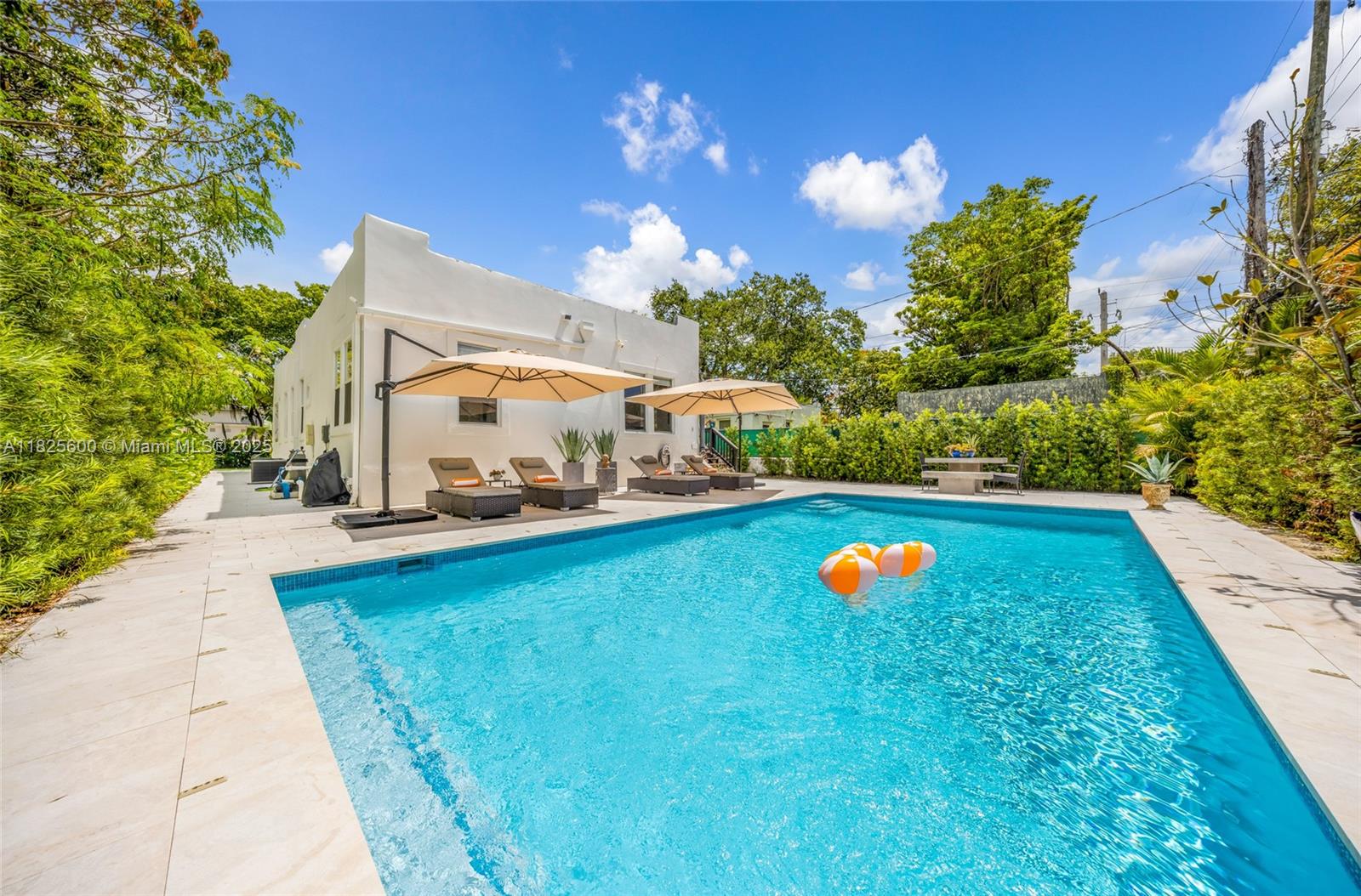 120 Northwest 49th Street Miami, FL 33127 - Photo 24 of 35 a view of a house with a swimming pool