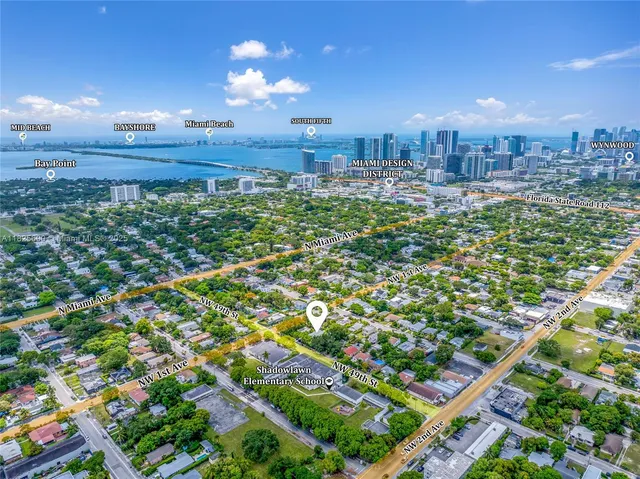 a view of a multi story building with a yard