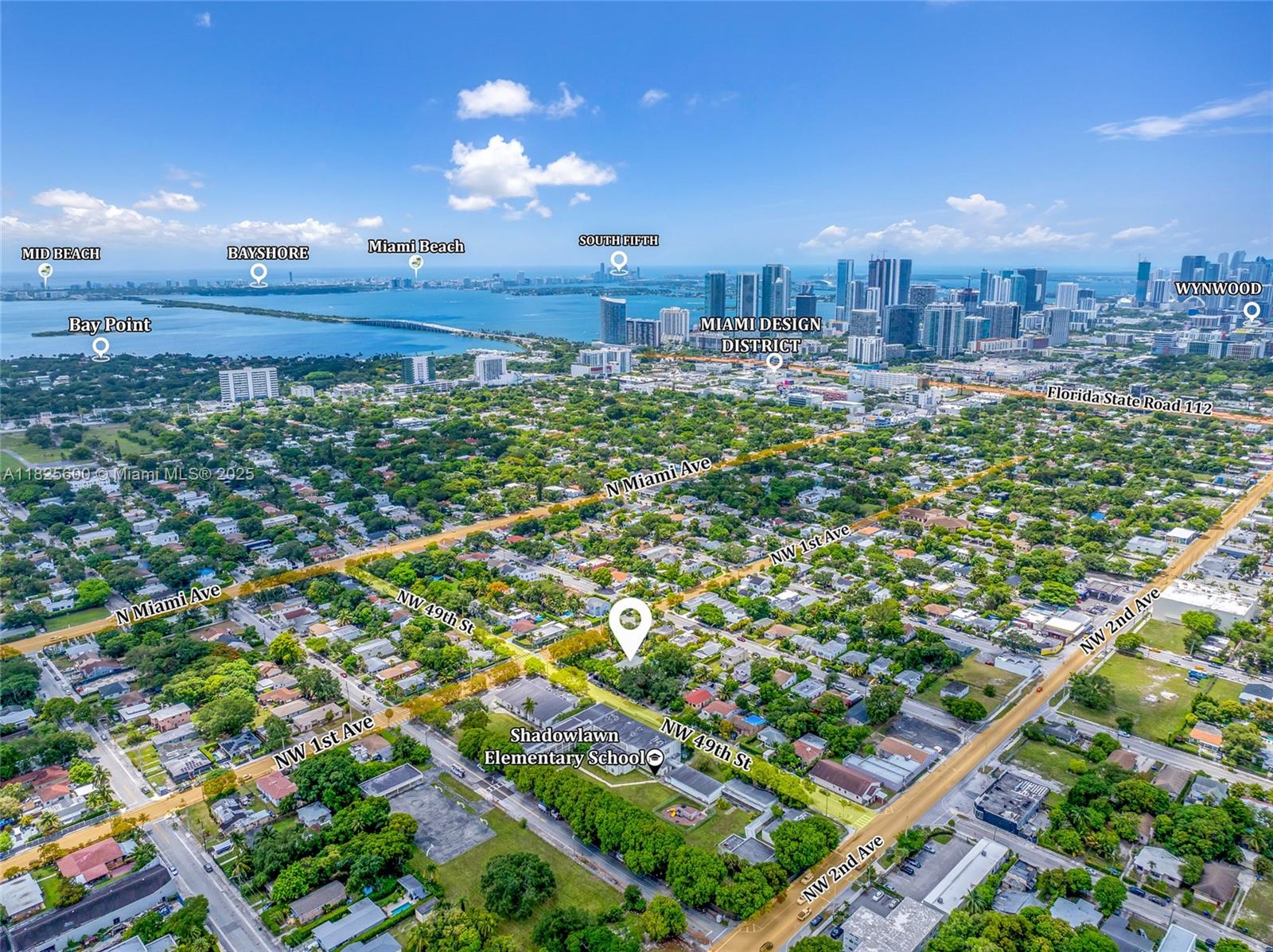 120 Northwest 49th Street Miami, FL 33127 - Photo 26 of 35 a view of a multi story building with a yard