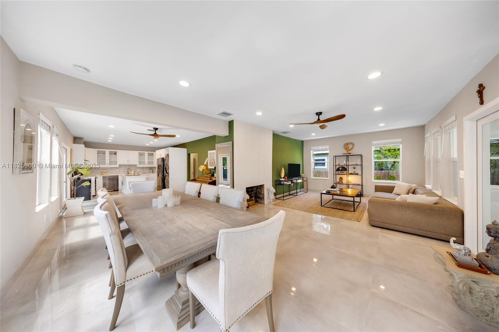 120 Northwest 49th Street Miami, FL 33127 - Photo 4 of 35 a living room with fireplace furniture and a large window