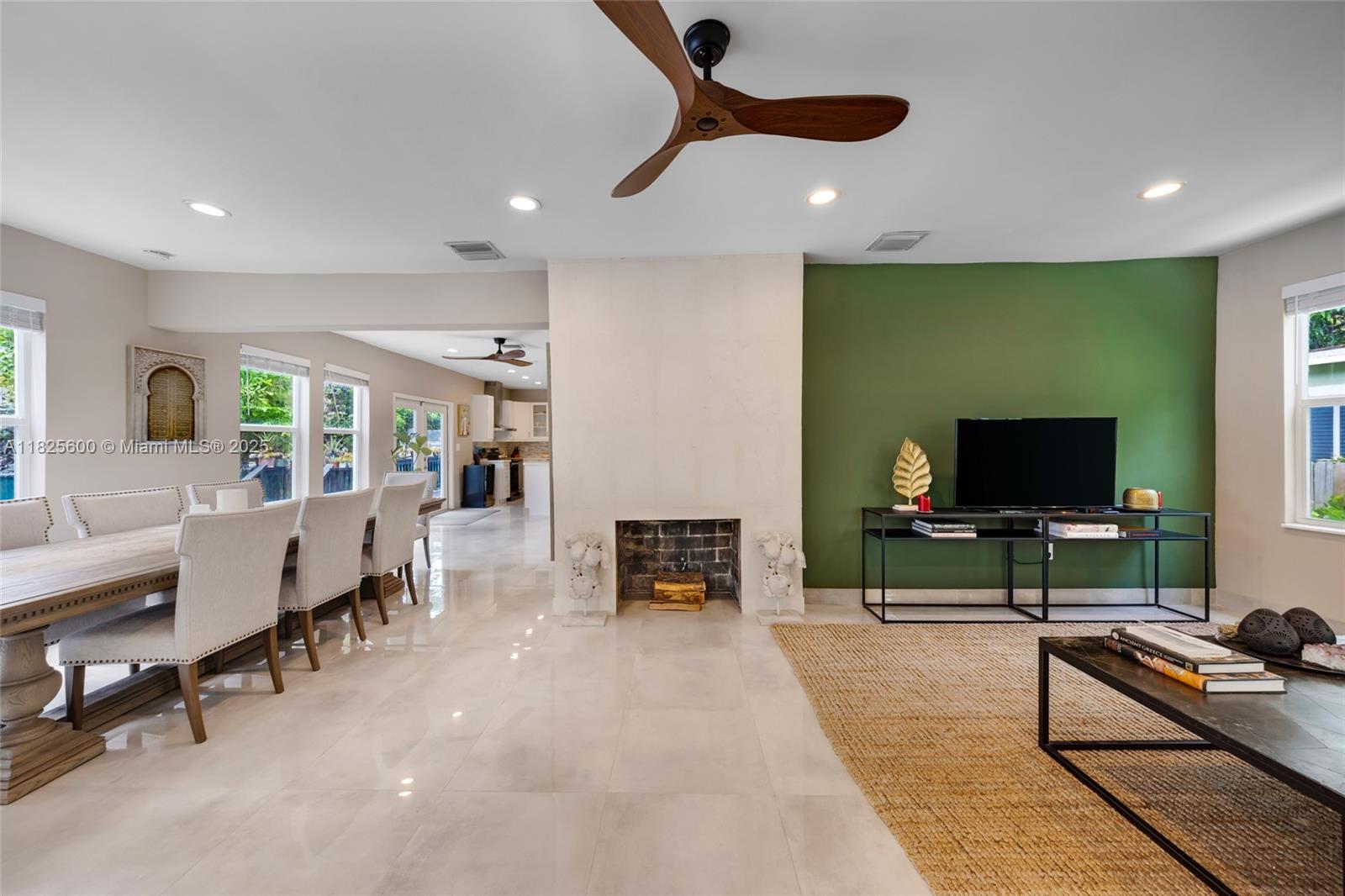 120 Northwest 49th Street Miami, FL 33127 - Photo 7 of 35 a living room with furniture and a flat screen tv